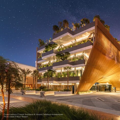 Night view of Belgian Pavilion and its green terraces.