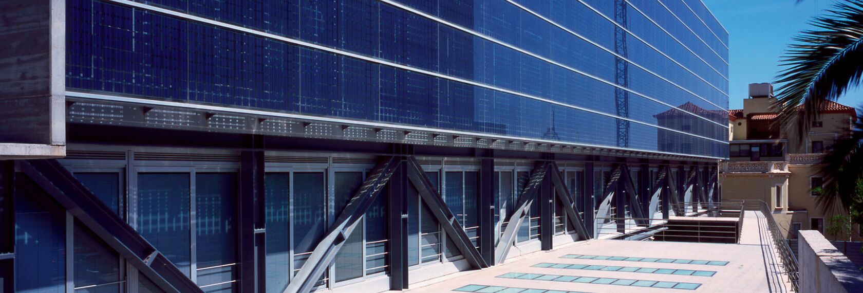 Interior view of skyscraper penthouse with flames showing through the windows.